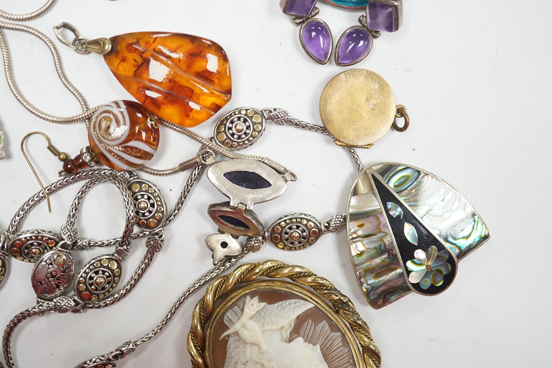 Assorted sterling , white metal and enamel jewellery including a charm bracelet, Siamese brooches, 925 and yellow metal necklace, etc. Condition - poor to fair to good